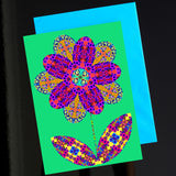 'Flower cutout on green' card